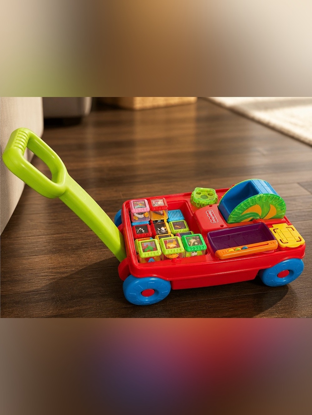 Vintage Fisher-Price Peek-a-boo Pull Toy with Green Handle and Blue Wheels
